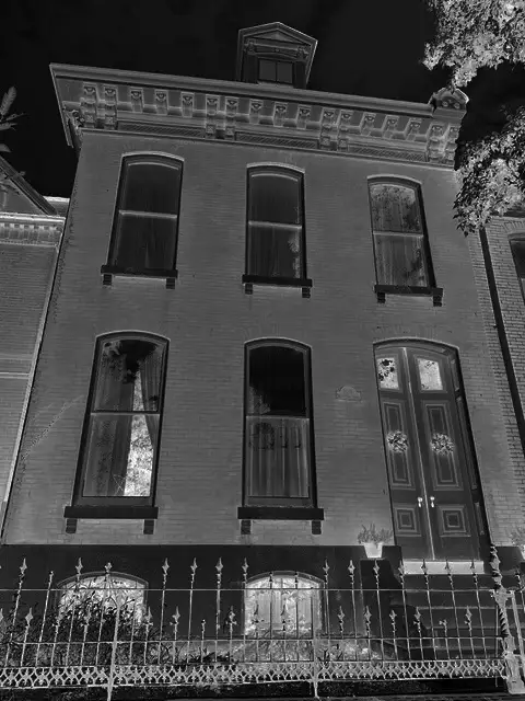 A Soulard house at night, in stark black and white.